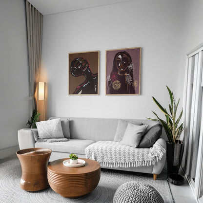 Framed floral-inspired line art of women, displayed in a cozy living room setting.